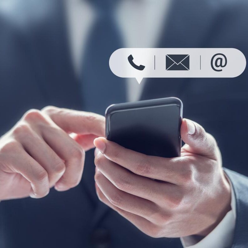 Contact Hub for Collaboration and Partnerships – a professional using a smartphone with icons for phone, email, and messaging options.